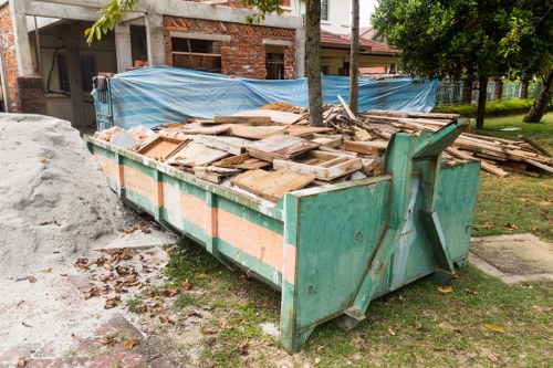 Professionals clearing garden in Chelsea